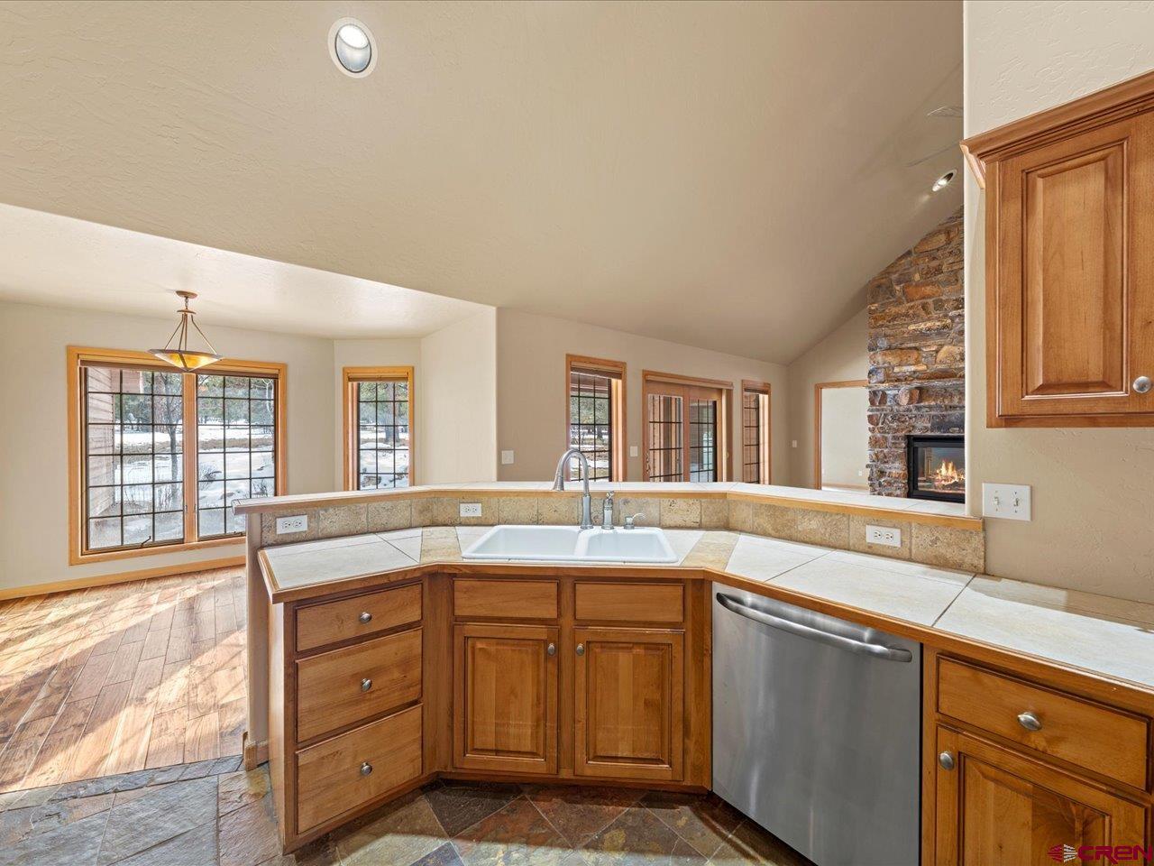 203 Puma Lane Ridgway, CO 81432 - Photo 27 of 43 a kitchen with granite countertop sink and window