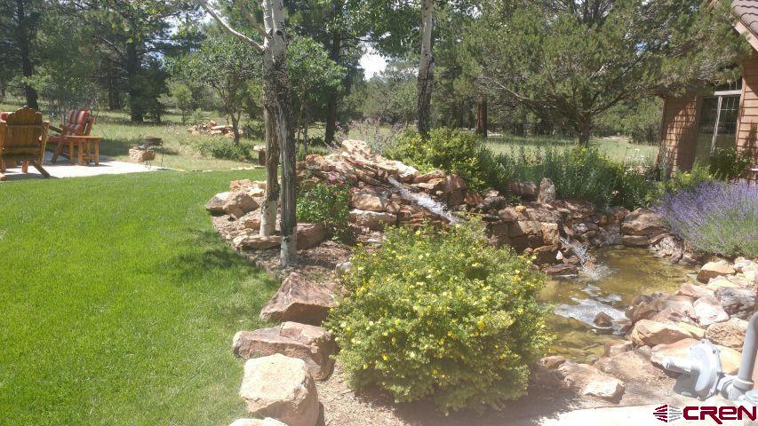 203 Puma Lane Ridgway, CO 81432 - Photo 4 of 43 a backyard of a house with lots of green space