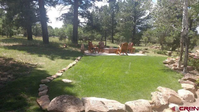 a backyard of a house with lots of green space