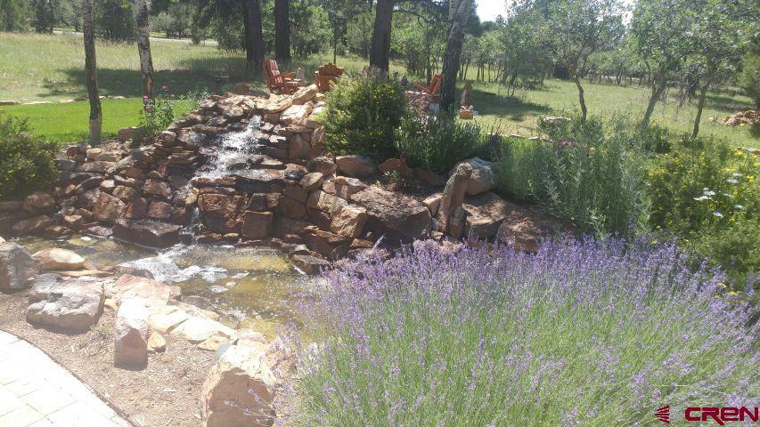 203 Puma Lane Ridgway, CO 81432 - Photo 7 of 43 a backyard of a house with lots of green space