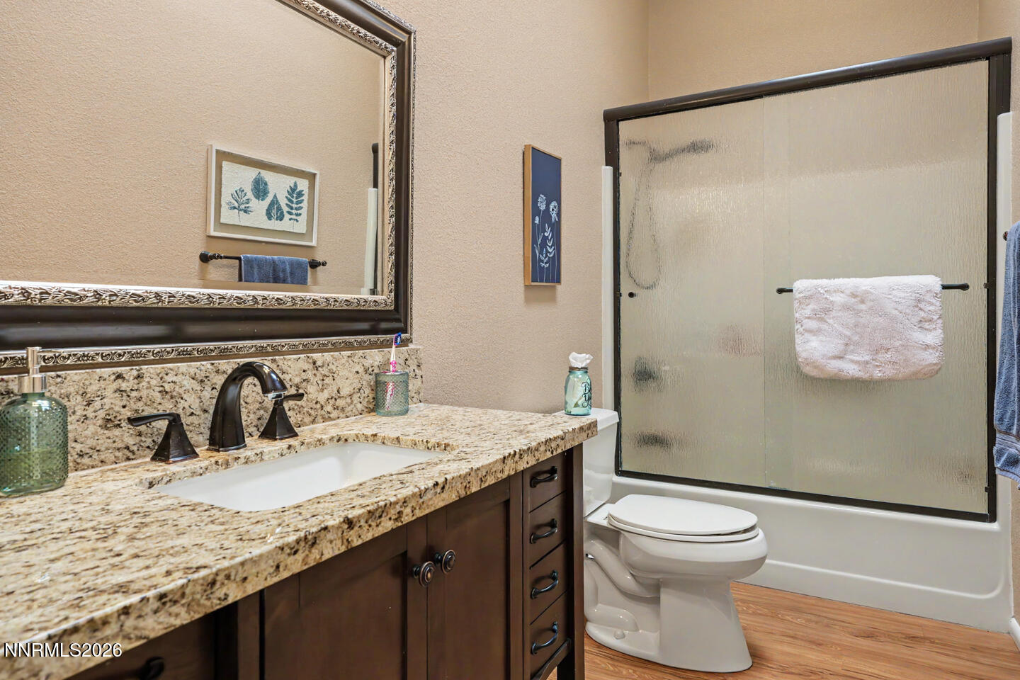 1500 Manchester Circle Fallon, NV 89406 - Photo 15 of 41 a bathroom with a granite countertop sink a toilet and a mirror