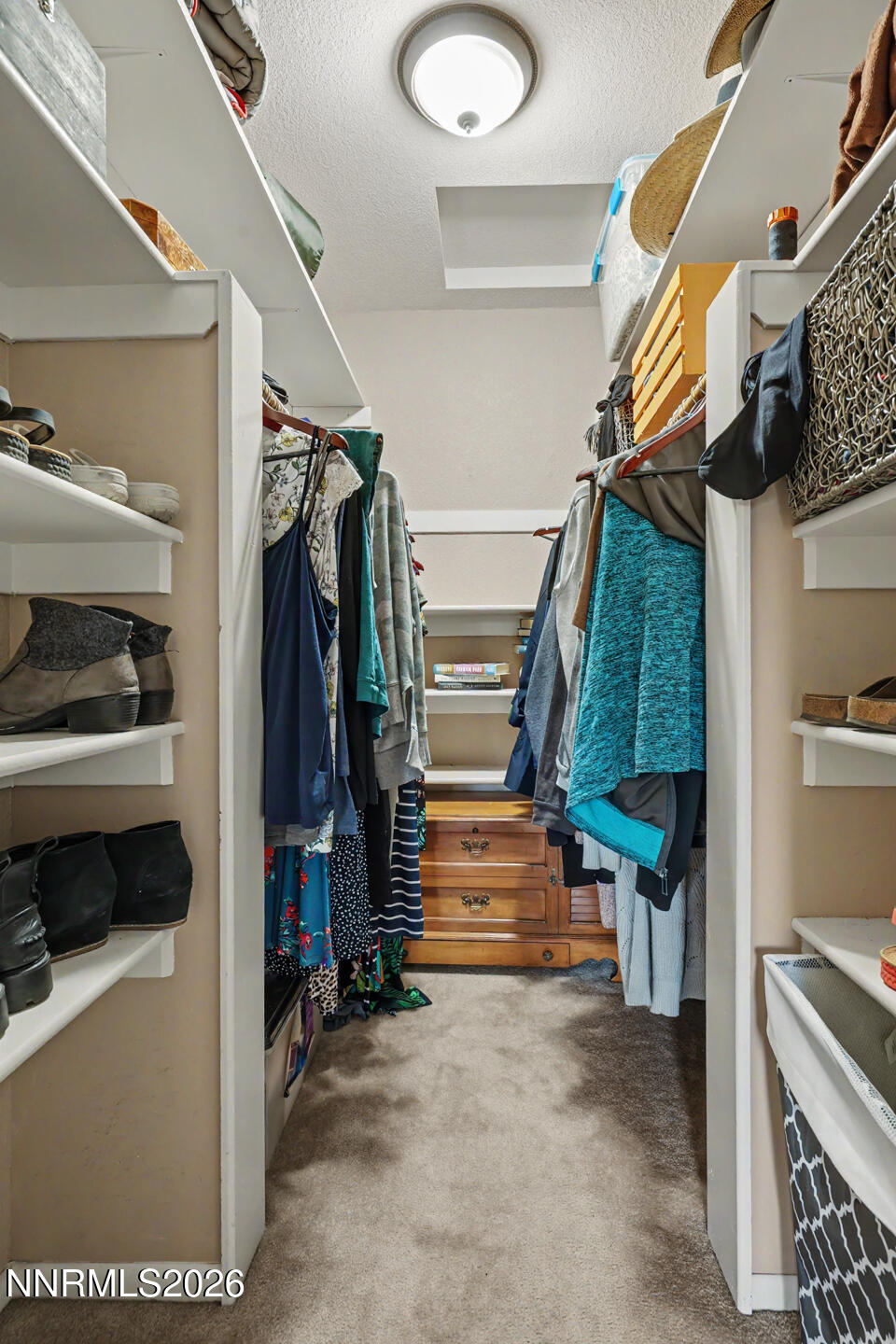 1500 Manchester Circle Fallon, NV 89406 - Photo 21 of 41 a view of walk in closet with clothes and shoes