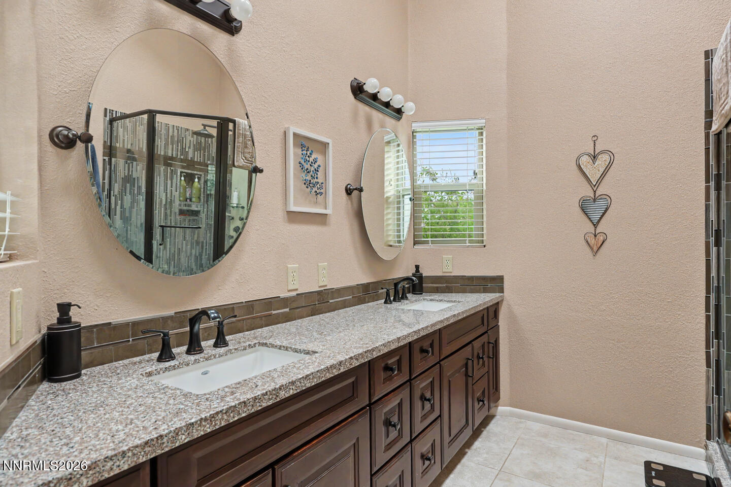 1500 Manchester Circle Fallon, NV 89406 - Photo 22 of 41 a bathroom with a granite countertop double vanity sink and a mirror