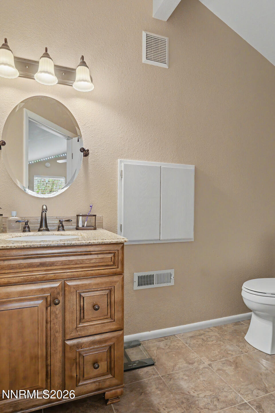 1500 Manchester Circle Fallon, NV 89406 - Photo 28 of 41 a bathroom with a sink a toilet and mirror
