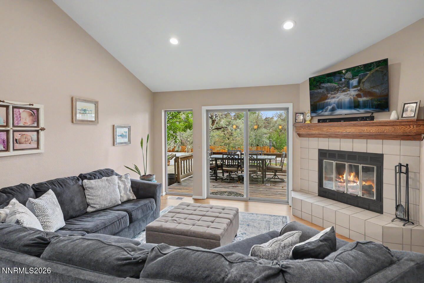 1500 Manchester Circle Fallon, NV 89406 - Photo 6 of 41 a living room with furniture a flat screen tv and a fireplace