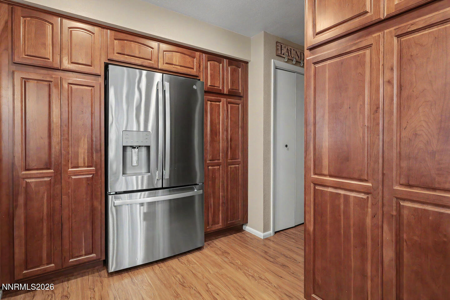 1500 Manchester Circle Fallon, NV 89406 - Photo 10 of 41 a kitchen with a refrigerator and wooden floor