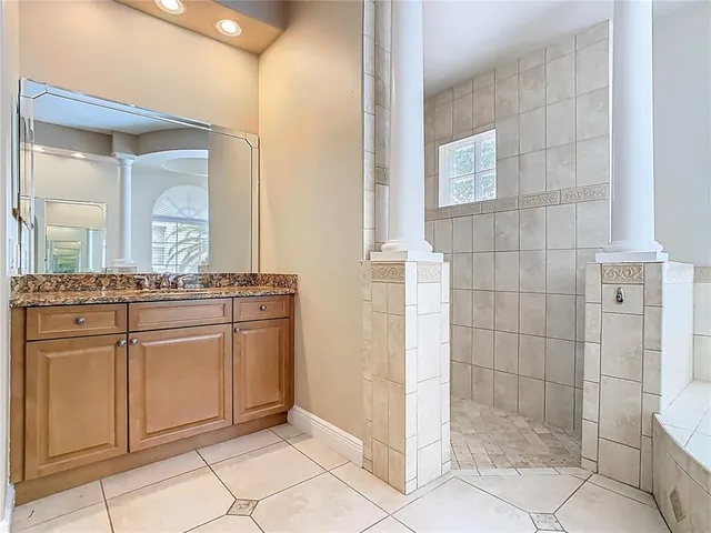 a kitchen with stainless steel appliances granite countertop a sink and a stove
