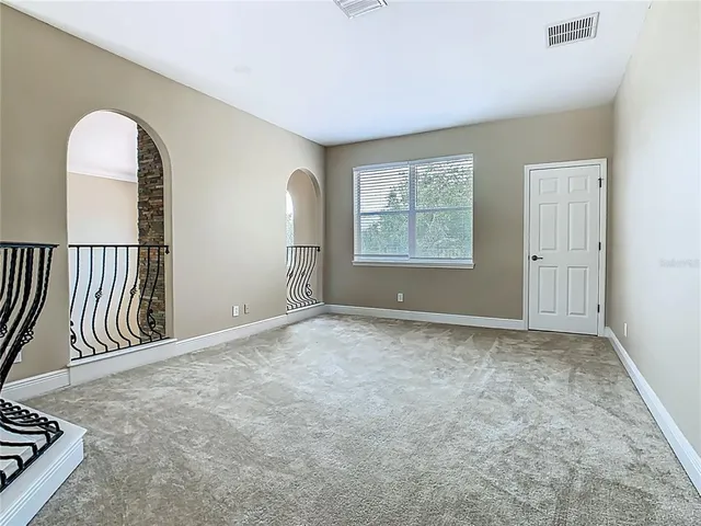 a bathroom with a bathtub shower sink mirror vanity and toilet
