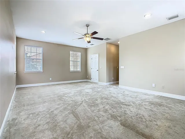 a view of an empty room and a window