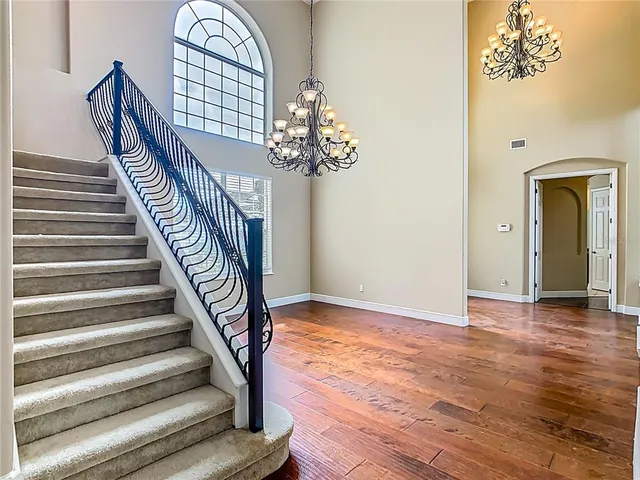 a view of an entryway with wooden floor