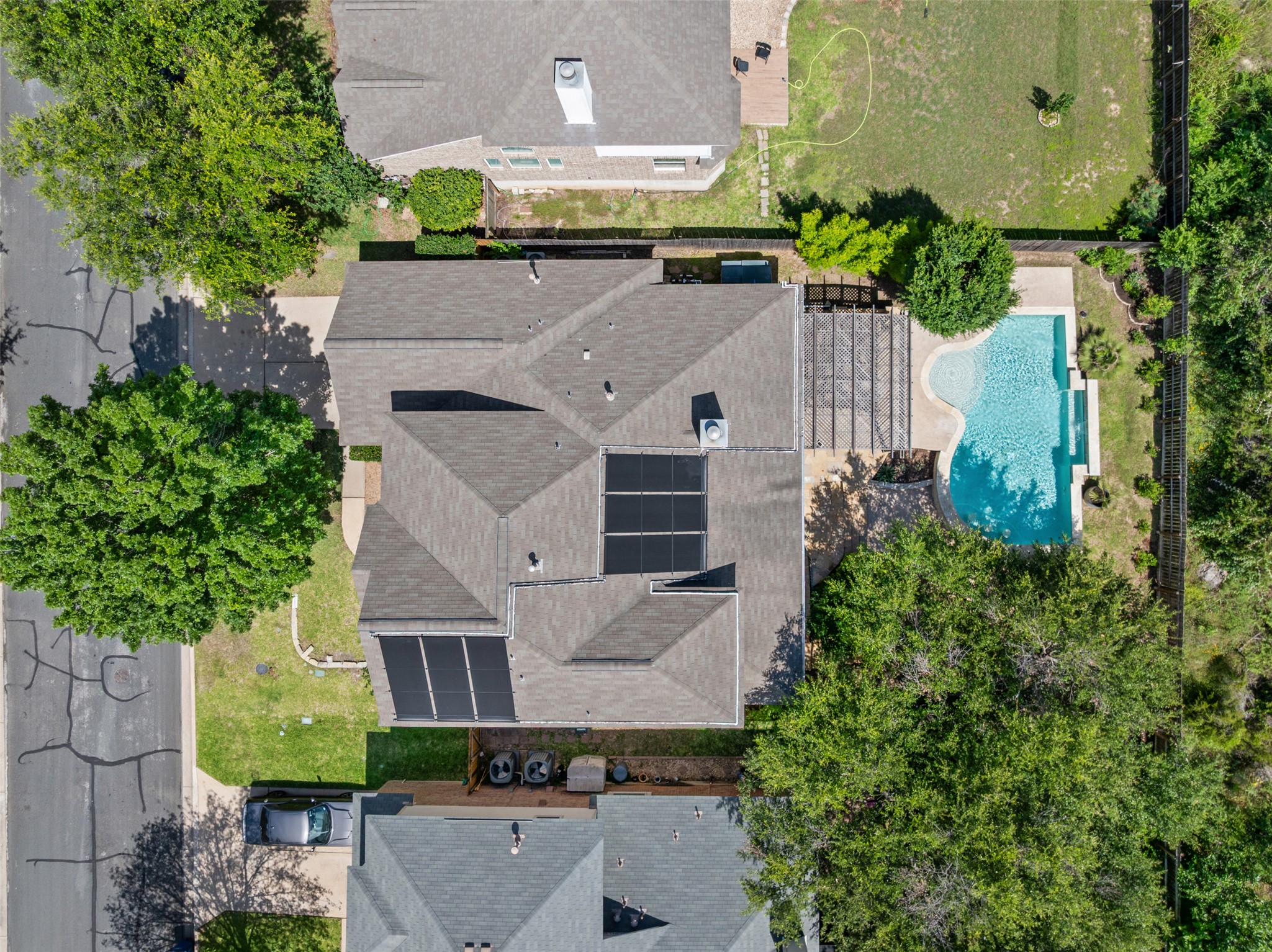 8820 Colberg Drive Austin, TX 78749 - Photo 33 of 35 An aerial perspective reveals a private pool with ample surrounding patio space, perfect for outdoor relaxation.