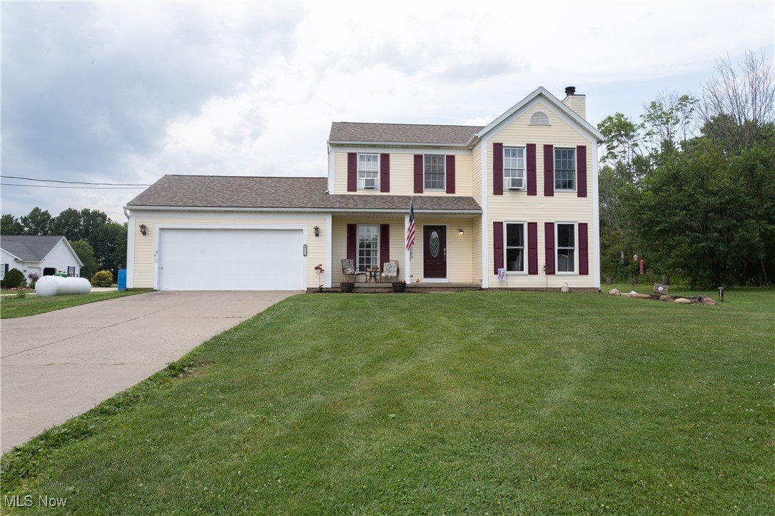 4171 Laubert Road Atwater, OH 44201 - Photo 41 of 42 View of front of property with a garage and a front lawn