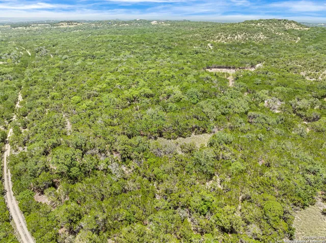 a view of a field with an outdoor space