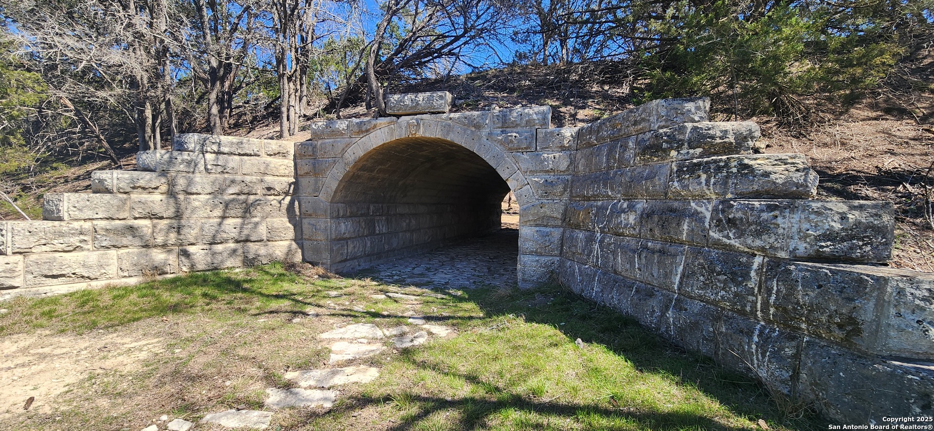 311 Spanish Pass Road Boerne, TX 78006 - Photo 7 of 8 a view of entrance gate of house with green space