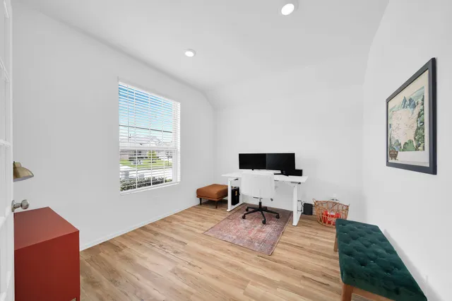 a workspace with furniture and a window