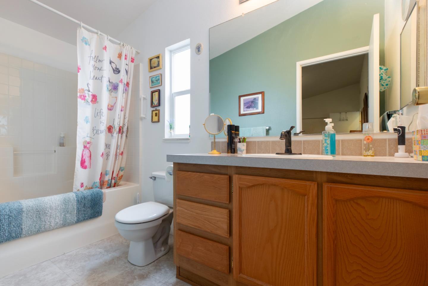 100 North Rodeo Gulch Road, Unit 63 Soquel, CA 95073 - Photo 13 of 21 a bathroom with a toilet sink and mirror