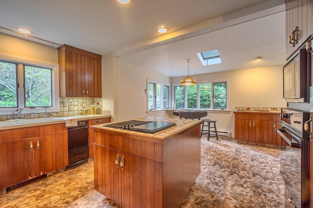 150 Pine Street Manchester, MA 01944 - Photo 11 of 38 a kitchen with a stove a sink and a microwave