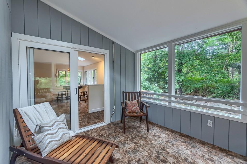 150 Pine Street Manchester, MA 01944 - Photo 15 of 38 a living room with a couch and a table