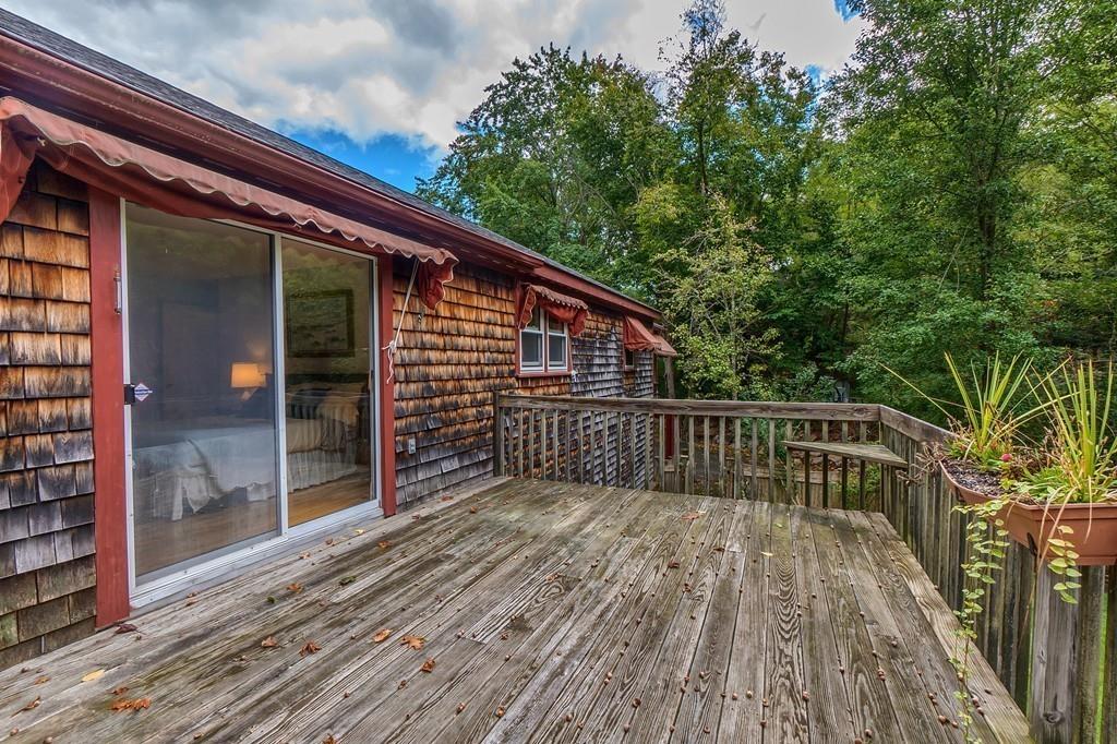 150 Pine Street Manchester, MA 01944 - Photo 18 of 38 a view of balcony with wooden floor and fence