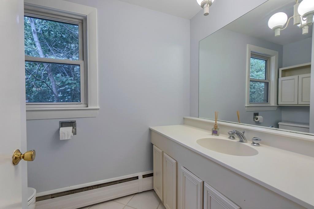 150 Pine Street Manchester, MA 01944 - Photo 19 of 38 a bathroom with a sink and a mirror