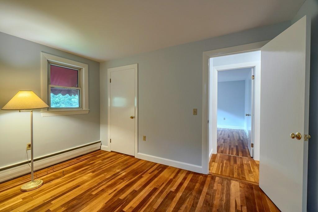 150 Pine Street Manchester, MA 01944 - Photo 22 of 38 a view of a room with wooden floor and a bathroom
