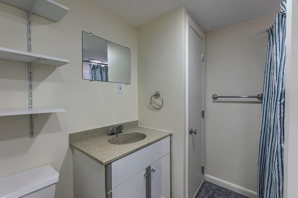 150 Pine Street Manchester, MA 01944 - Photo 25 of 38 a bathroom with a sink and a toilet