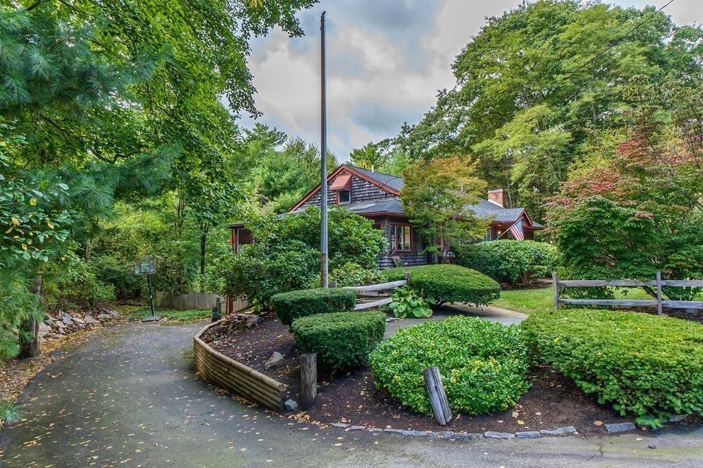 150 Pine Street Manchester, MA 01944 - Photo 27 of 38 a backyard of a house with a yard and outdoor seating