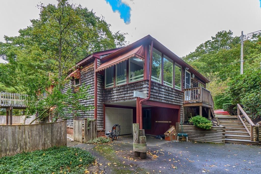 150 Pine Street Manchester, MA 01944 - Photo 28 of 38 a front view of a house with a garage