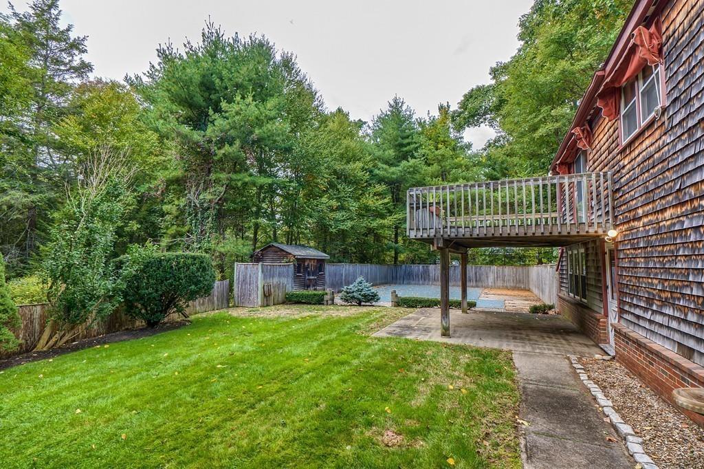150 Pine Street Manchester, MA 01944 - Photo 29 of 38 a view of a chair and table in backyard of the house