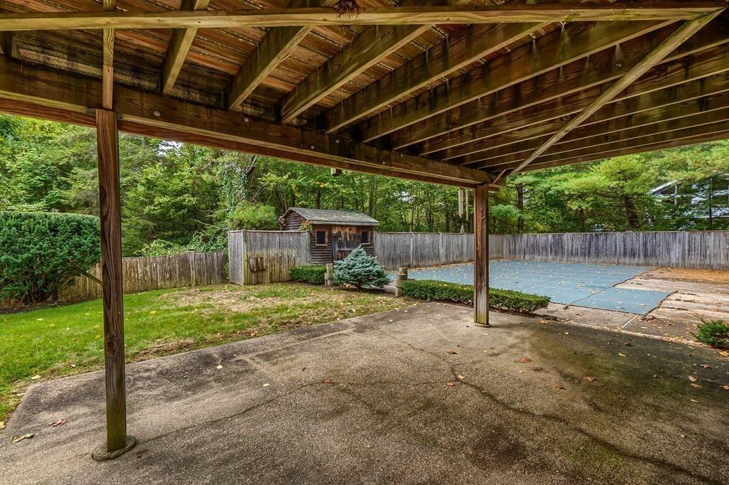 150 Pine Street Manchester, MA 01944 - Photo 31 of 38 a backyard of a house with table and chairs