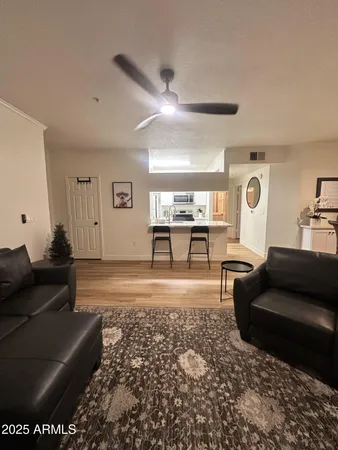 a living room with furniture and a rug