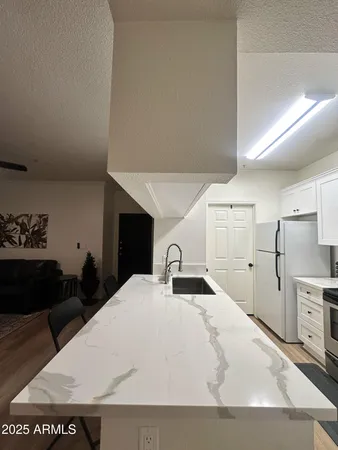 a large white bed in a white room