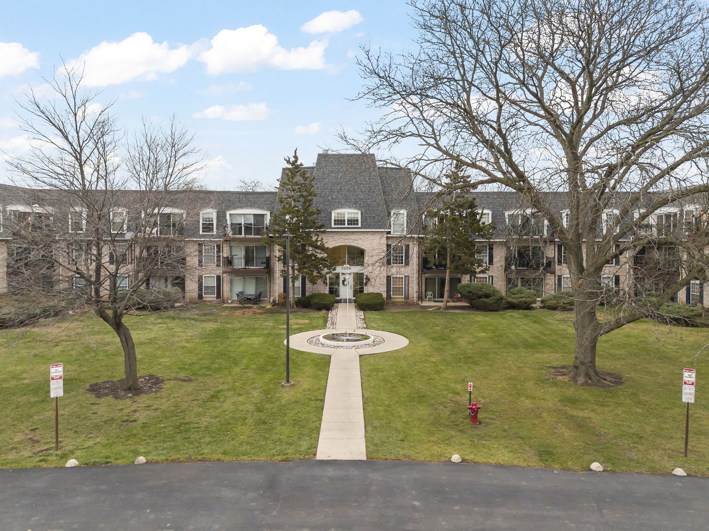 5200 Carriageway Drive, Unit 101 Rolling Meadows, IL 60008 - Photo 1 of 38 a view of a fountain in front of a building