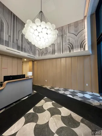 a view of entryway with a chandelier