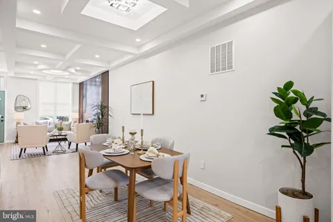 a kitchen with stainless steel appliances kitchen island granite countertop a stove a sink a refrigerator and a cabinets