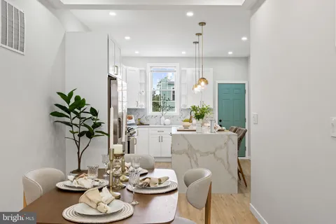a kitchen with stainless steel appliances granite countertop a stove and a sink