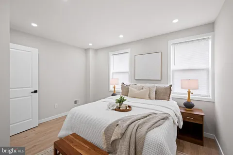 a bedroom with furniture and a potted plant