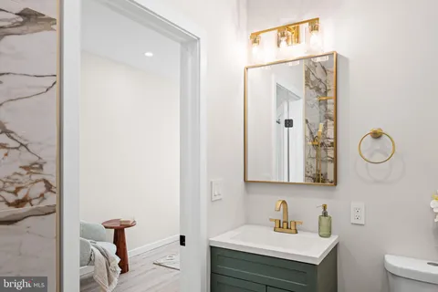 a view of a balcony with chairs and wooden floor