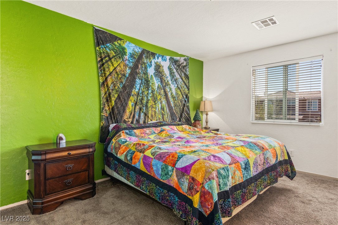 2664 Strichen Avenue Henderson, NV 89044 - Photo 14 of 25 Carpeted bedroom featuring baseboards, visible ven