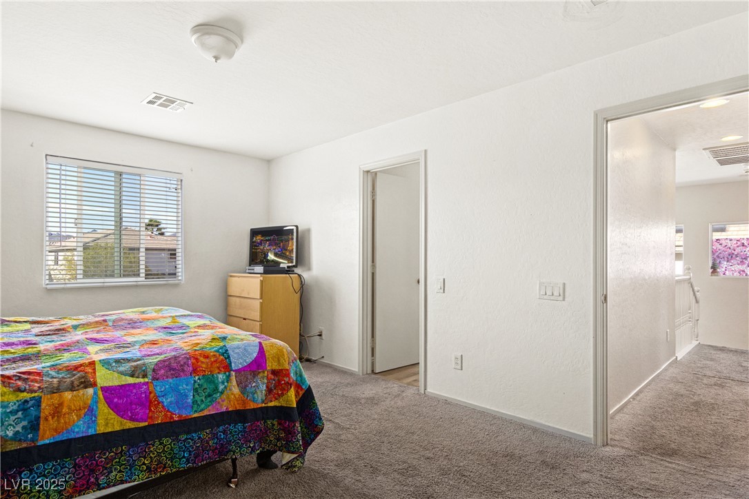2664 Strichen Avenue Henderson, NV 89044 - Photo 15 of 25 Bedroom with visible vents and carpet floors
