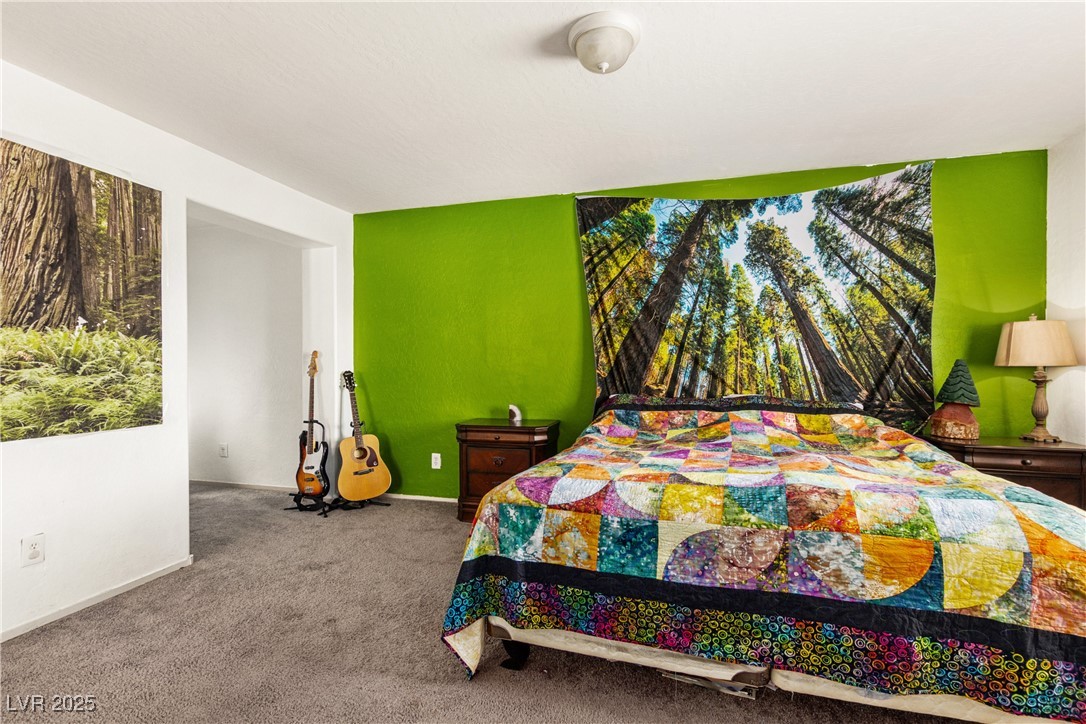 2664 Strichen Avenue Henderson, NV 89044 - Photo 16 of 25 Bedroom with baseboards and carpet