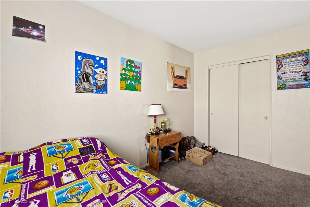 2664 Strichen Avenue Henderson, NV 89044 - Photo 19 of 25 Bedroom featuring a closet and carpet