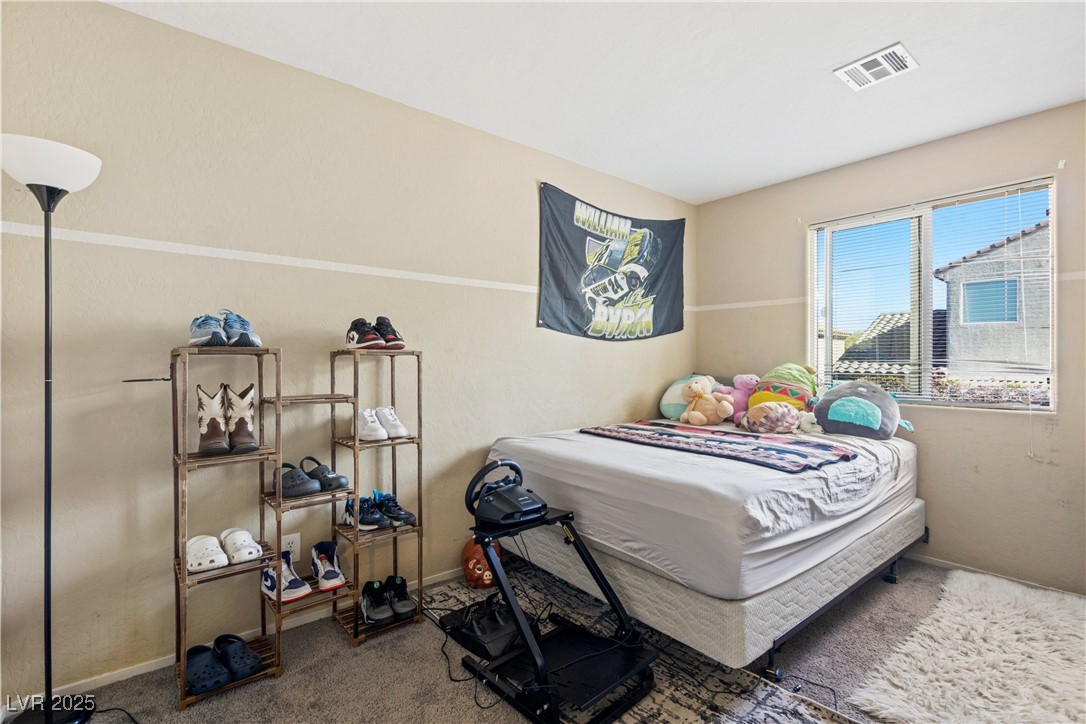 2664 Strichen Avenue Henderson, NV 89044 - Photo 20 of 25 Bedroom featuring carpet flooring, baseboards, and