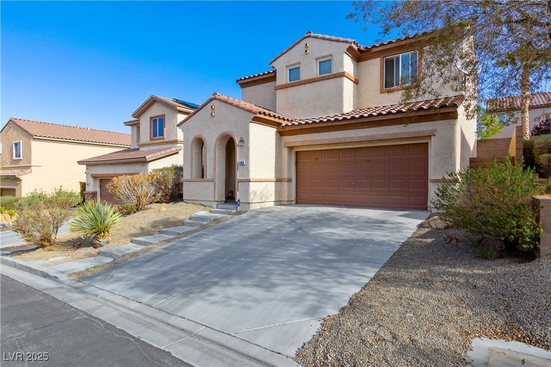 2664 Strichen Avenue Henderson, NV 89044 - Photo 2 of 25 Mediterranean / spanish-style home with driveway,