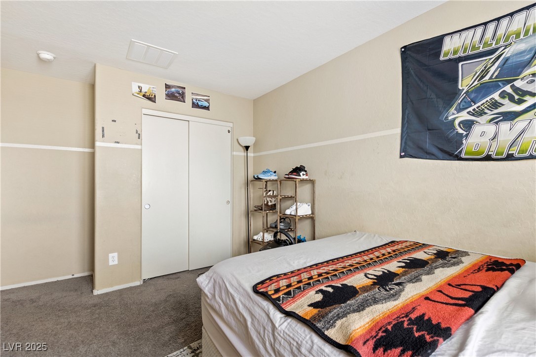 2664 Strichen Avenue Henderson, NV 89044 - Photo 21 of 25 Carpeted bedroom with a closet and visible vents