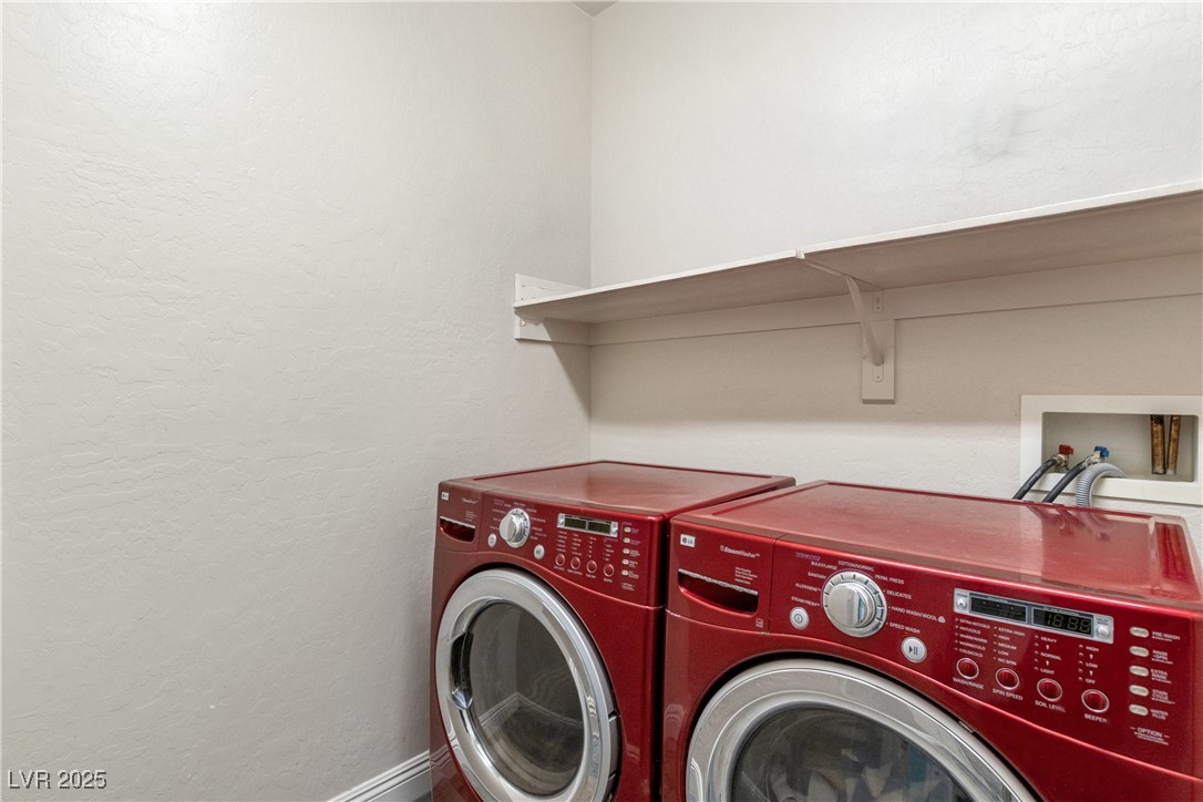 2664 Strichen Avenue Henderson, NV 89044 - Photo 23 of 25 Laundry room featuring a textured wall, washer and