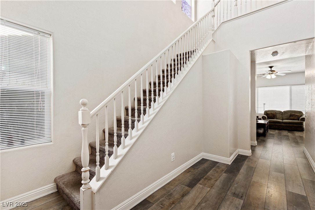 2664 Strichen Avenue Henderson, NV 89044 - Photo 3 of 25 Stairs featuring hardwood / wood-style floors, a t
