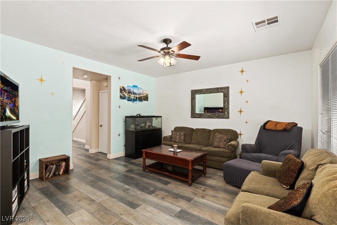 2664 Strichen Avenue Henderson, NV 89044 - Photo 6 of 25 Living room featuring stairs, baseboards, visible