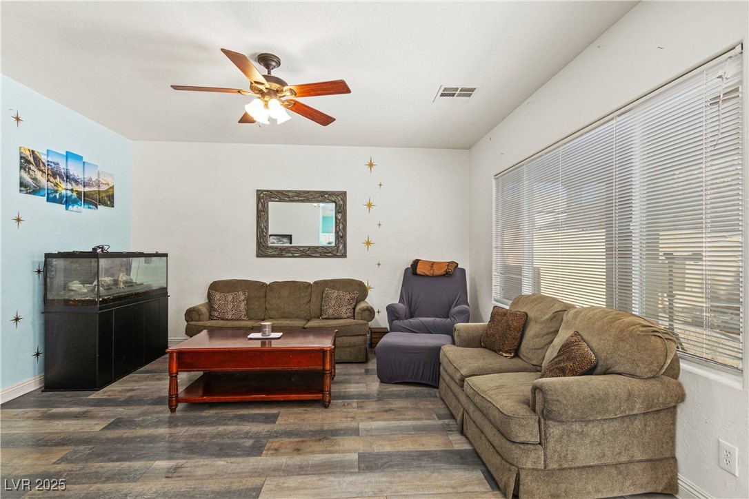 2664 Strichen Avenue Henderson, NV 89044 - Photo 7 of 25 Living room featuring baseboards, visible vents, w