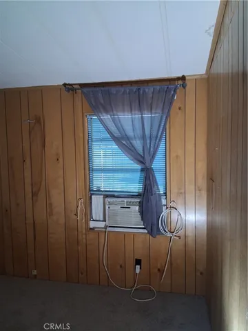 a view of entryway with wooden walls